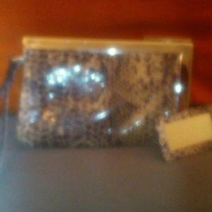 Snake skin ebmossed wristlet